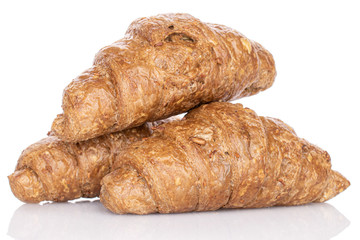 Group of three whole baked wholegrain croissant isolated on white