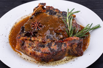  Fried pork meat baked in an oven with sauce and spices