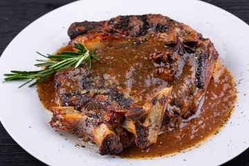  Fried pork meat baked in an oven with sauce and spices