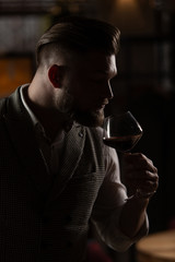 Professional sommelier man with a glass of red wine.