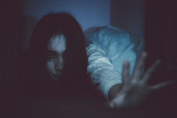 Portrait of asian woman make up ghost face with blood,Horror scene,Scary background,Halloween...