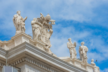 Fototapeta na wymiar Vatican, Rome / Italy 10.02.2015.Statues on the roofs of the Papal Basilica of Saint Peter in the Vatican