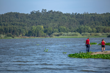 View at the lake of Pateira Fermentelos, landscape around and a couple on banks