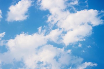 White clouds in the blue sky.