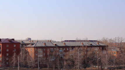Fototapeta na wymiar urban roofs of houses and sky, cityscape