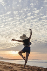 Dance and jump beautiful female silhouette on outdoors background. Dawn sky enjoyment