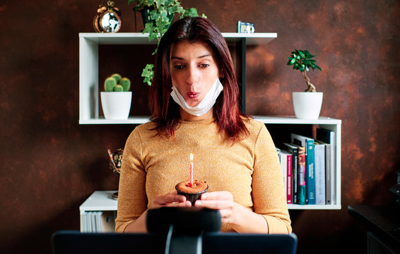 Birthday video conference through the computer screen. Distance love, social distancing, friendship, surprise, quarantine, isolation, stay home concept