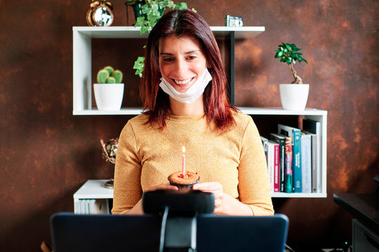 Birthday video conference through the computer screen. Distance love, social distancing, friendship, surprise, quarantine, isolation, stay home concept