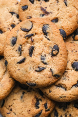 Cookies with chocolate on rustic background close-up.