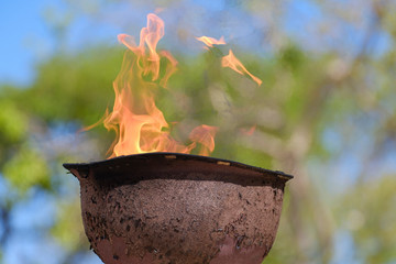 memorial fire in a soldiers helmet