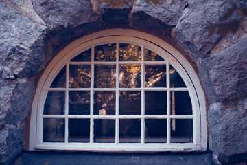 Round window on a stone wall