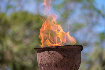 memorial fire in a soldiers helmet