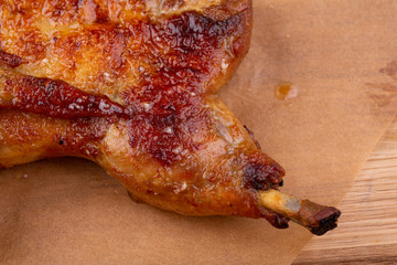 Chicken tobacco fried on coal with garlic, served with greens and ketchup