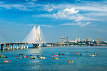 Mumbai skyline Bandra - Worli Sea Link bridge with fishing boats view from Bandra fort. Mumbai, Maharashtra, India - 341680834