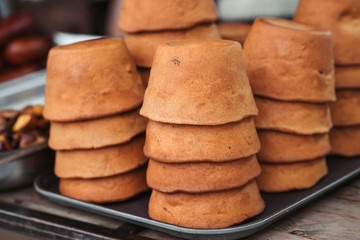 Bread bowls for soup on street market. Street food.