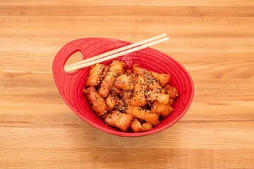 red bowl with Thai torreznos