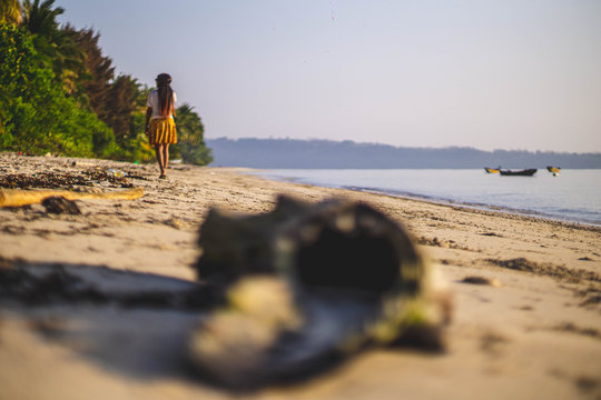 a girl walking on the beach in havelock andaman india