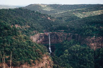 Fototapeta premium View of Surla or Sural waterfall in Goa and the green valley and mountains surrounded