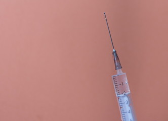 a syringe with a vaccine to work with the covid-19 coronavirus pandemic during the epidemic