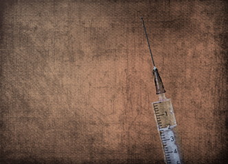 a syringe with a vaccine to work with the covid-19 coronavirus pandemic during the epidemic