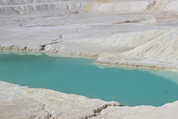 Background from white clay and blue water
