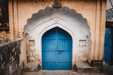Fototapeta na wymiar Blue gate and arch above them in oriental style
