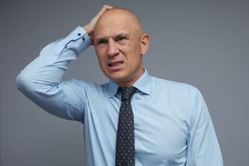 A businessman has problems and does not know how to solve them.