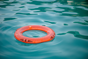 orange tube floating on water