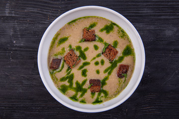 Cream soup with grenels, served with sauce