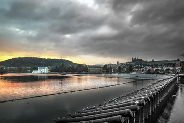 sunset over the river in prague