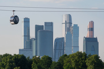 Naklejka premium Cable cars above Moscow river and skyscrapers of Moscow city. Moscow, Russia.