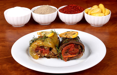 Eggplant jam and green bell pepper with delicious vegetables ready to serve on a white plate