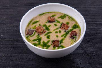 Cream soup with grenels, served with sauce