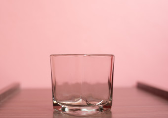 Cup on pink pastel background.