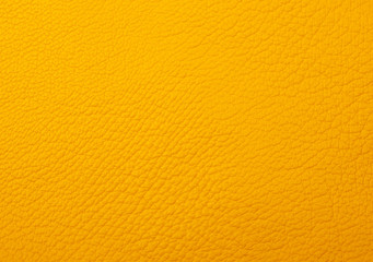 Bright yellow leather as a leather texture or an abstract yellow background