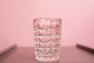 Cup on pink pastel background.