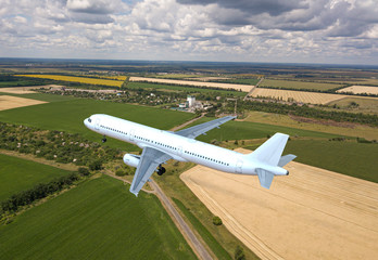 Jet passenger plane flying low above the earth. 3d illustration