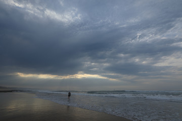 An early fisherman waiting for a bait