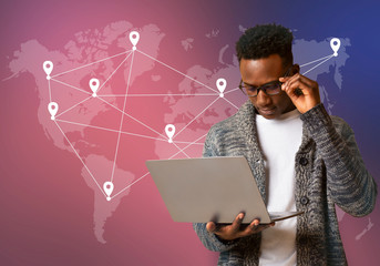 Black hacker holding laptop with virtual display server data
