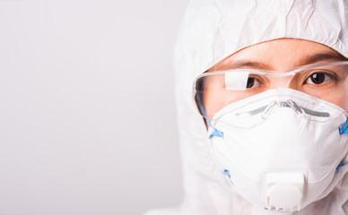 woman doctor or scientist in PPE suite uniform wearing face mask N95 protective