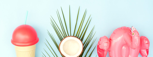 Beautiful summer background with bright accessories and a palm branch.