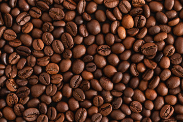 Roasted coffee beans background, top view
