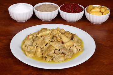 chicken with a very nice curry sauce with fragrant Turkish spices on a white plate