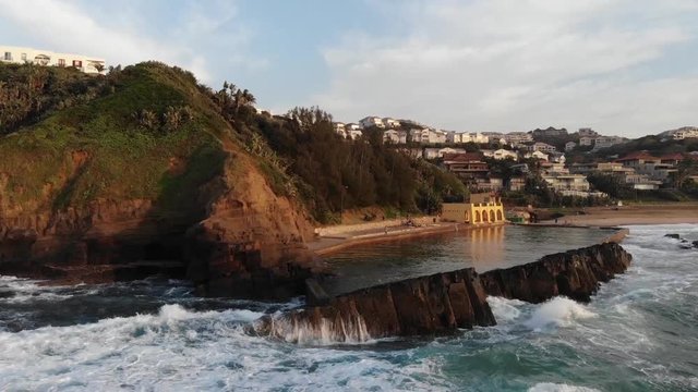 Thompsons Bay with water splashing against rocks in Ballito