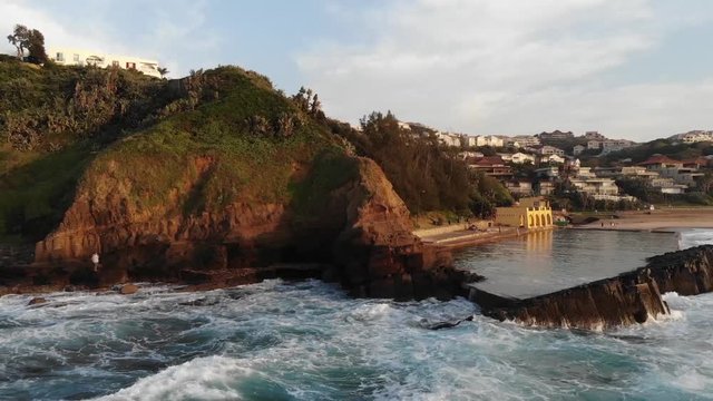 Thompsons Bay with water splashing against rocks in Ballito