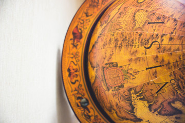 Fototapeta na wymiar wooden globe on wooden surface