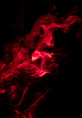 Red smoke on black background