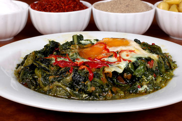 perfect turkish food egg spinach spicy on plate close up