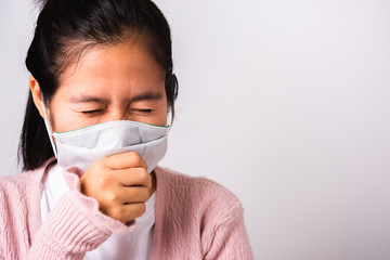 woman wearing surgical protection cloth face mask hygiene against coronavirus and her sneeze