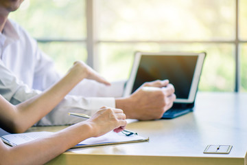 Hand of business woman or secretary take note on paperwork or sign contact while business meeting at office, business financial presentation conference concept